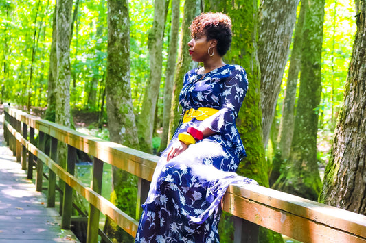 floral dress, yellow belt, wooden bangles, pop of color, nature